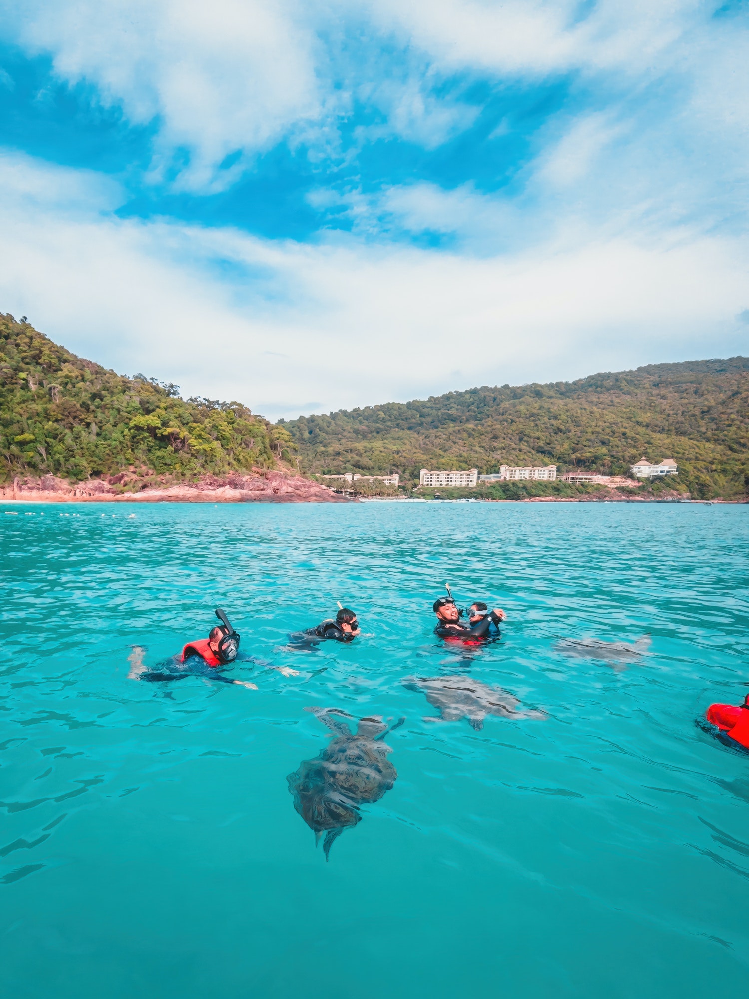 Redang, Malaysia - May 11, 2022: Group of tourists are snorkeling together on a tour.